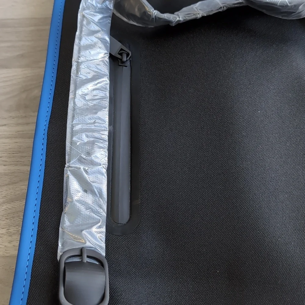 NWT RAINS Blue Waterproof Backpack Laptop Sleeve Sleek Adjustable Unisex